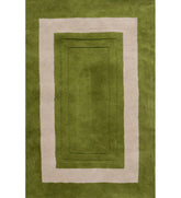 Green hand-tufted wool rug with ivory rectangular border